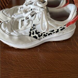 Stylish Nike White Sneakers with Leopard and Orange Accents